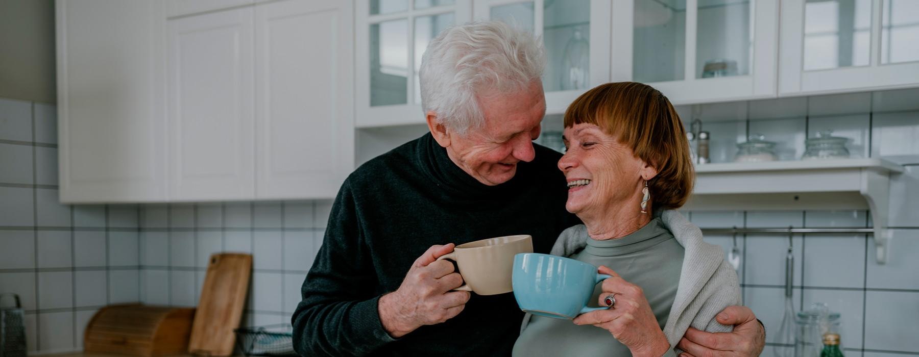 a man and a woman holding a mug